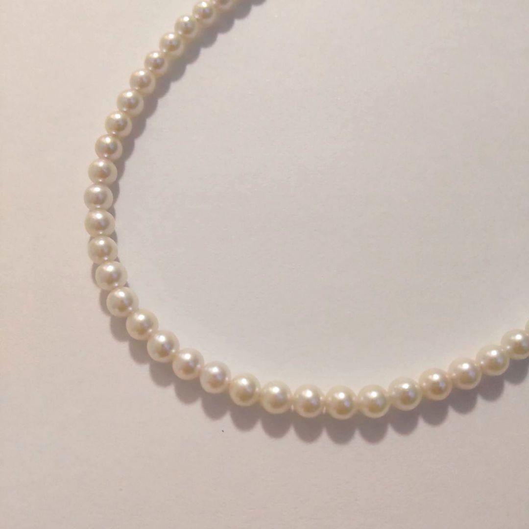 Close-up of Baby Akoya Pearl Necklace with 3-3.5mm pearls, 43cm length, displayed on a white background