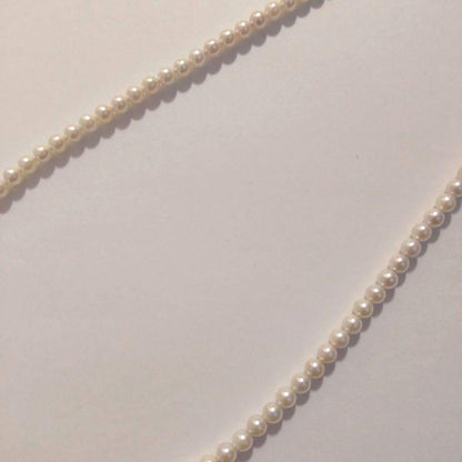 Close-up of Baby Akoya Pearl Necklace with 3-3.5mm pearls, 43cm length, displayed on a white background