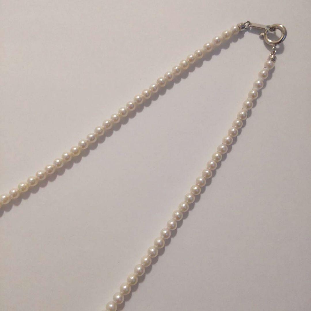 Close-up of Baby Akoya Pearl Necklace with 3-3.5mm pearls, 43cm length, displayed on a white background