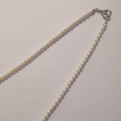 Close-up of Baby Akoya Pearl Necklace with 3-3.5mm pearls, 43cm length, displayed on a white background