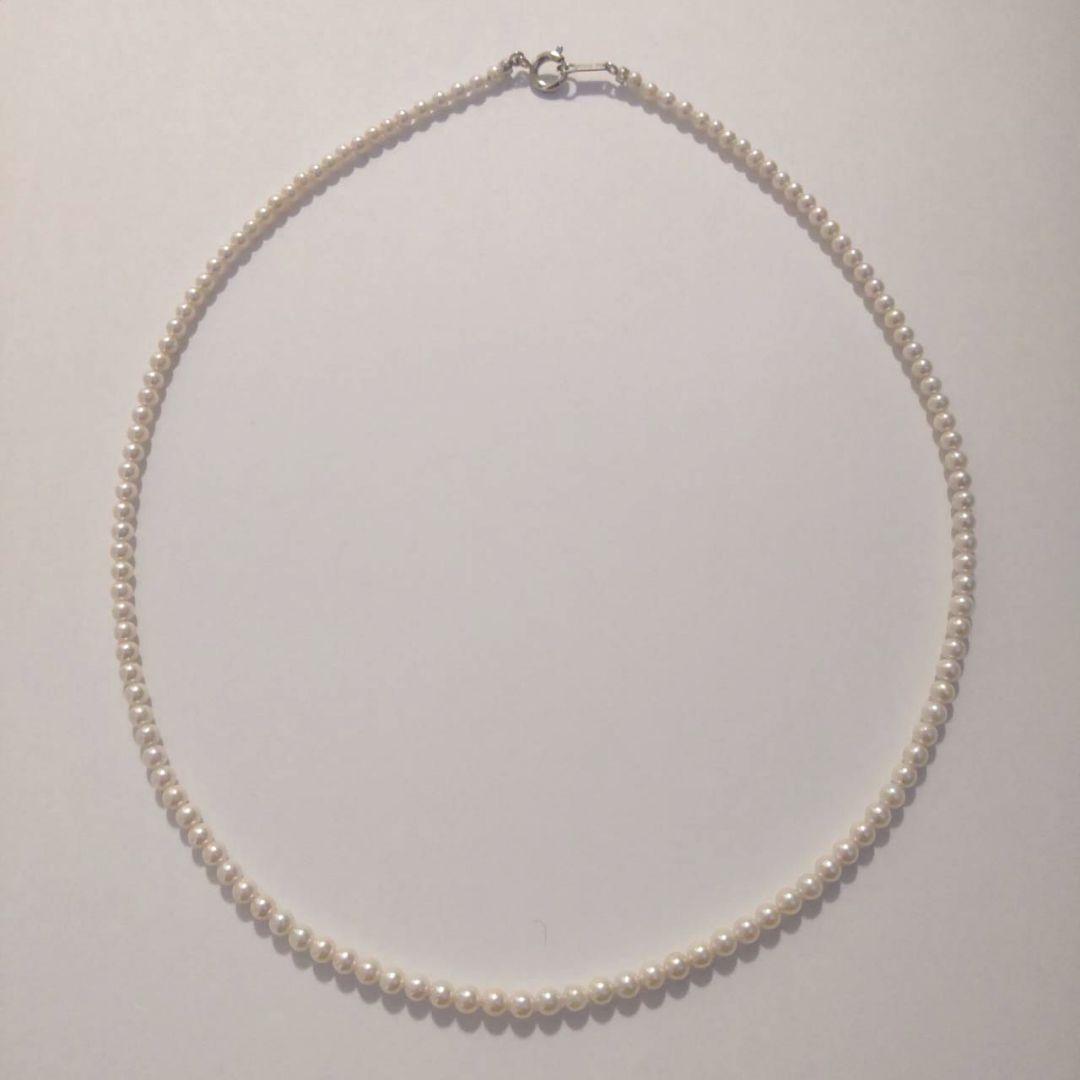Close-up of Baby Akoya Pearl Necklace with 3-3.5mm pearls, 43cm length, displayed on a white background