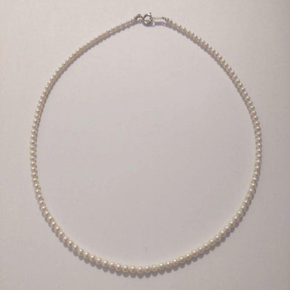Close-up of Baby Akoya Pearl Necklace with 3-3.5mm pearls, 43cm length, displayed on a white background