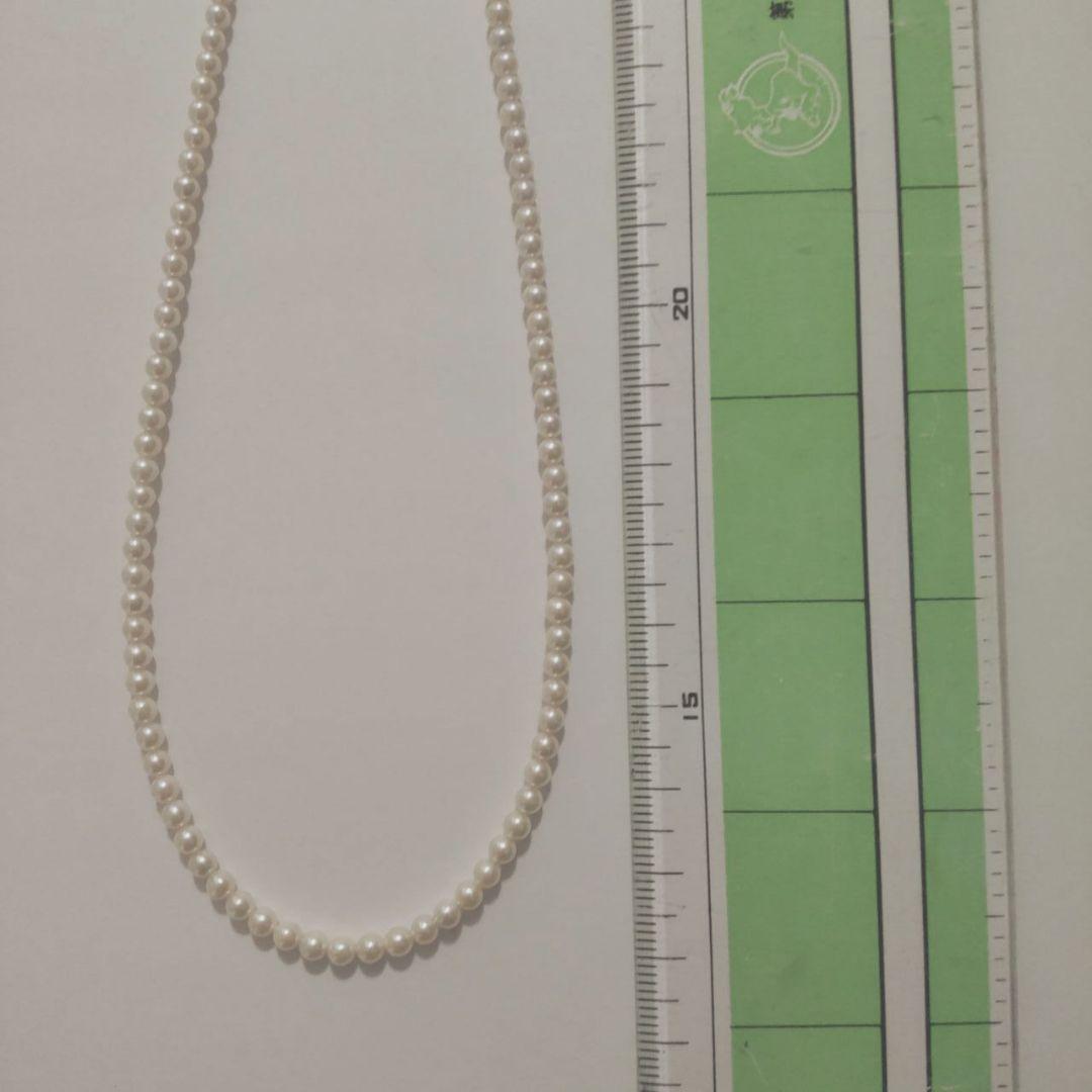 Close-up of Baby Akoya Pearl Necklace with 3-3.5mm pearls, 43cm length, displayed on a white background