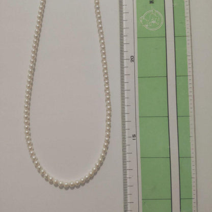 Close-up of Baby Akoya Pearl Necklace with 3-3.5mm pearls, 43cm length, displayed on a white background