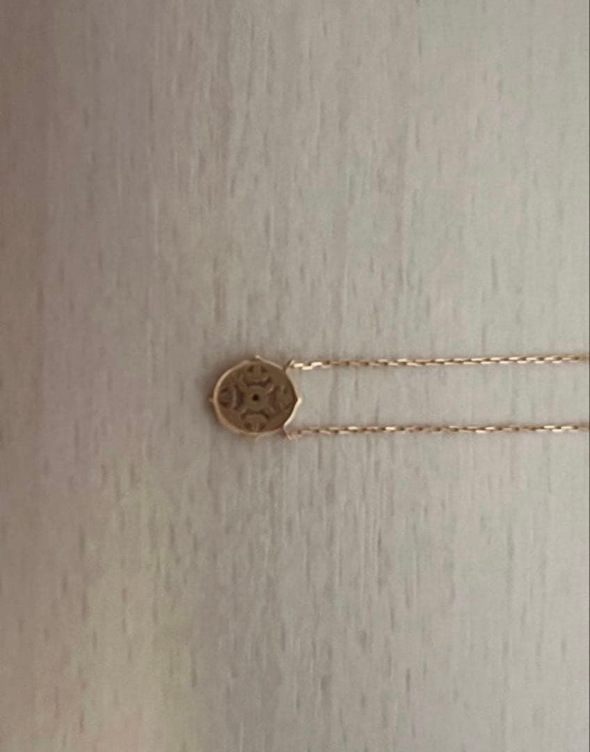 agete K10 gold necklace featuring a 0.01ct diamond pendant on delicate chain