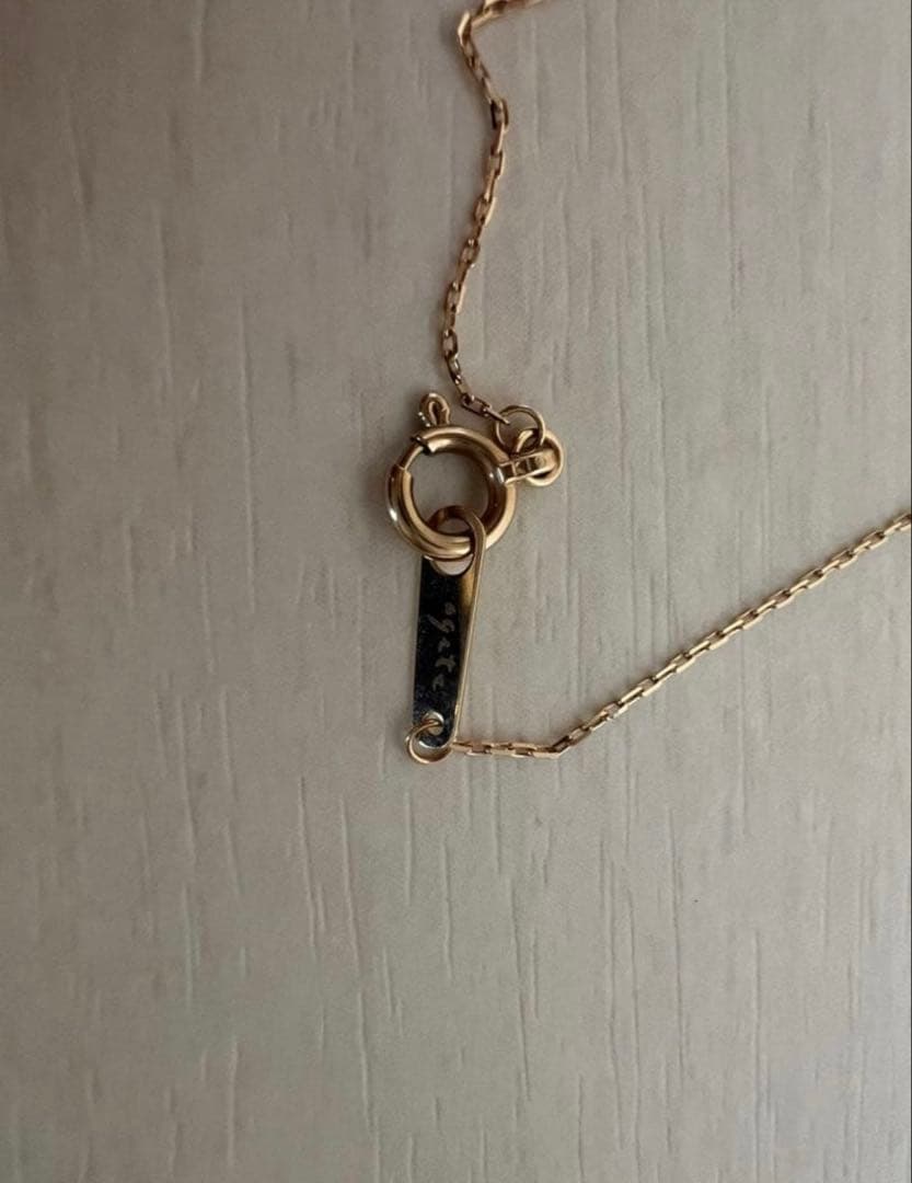 agete K10 gold necklace featuring a 0.01ct diamond pendant on delicate chain