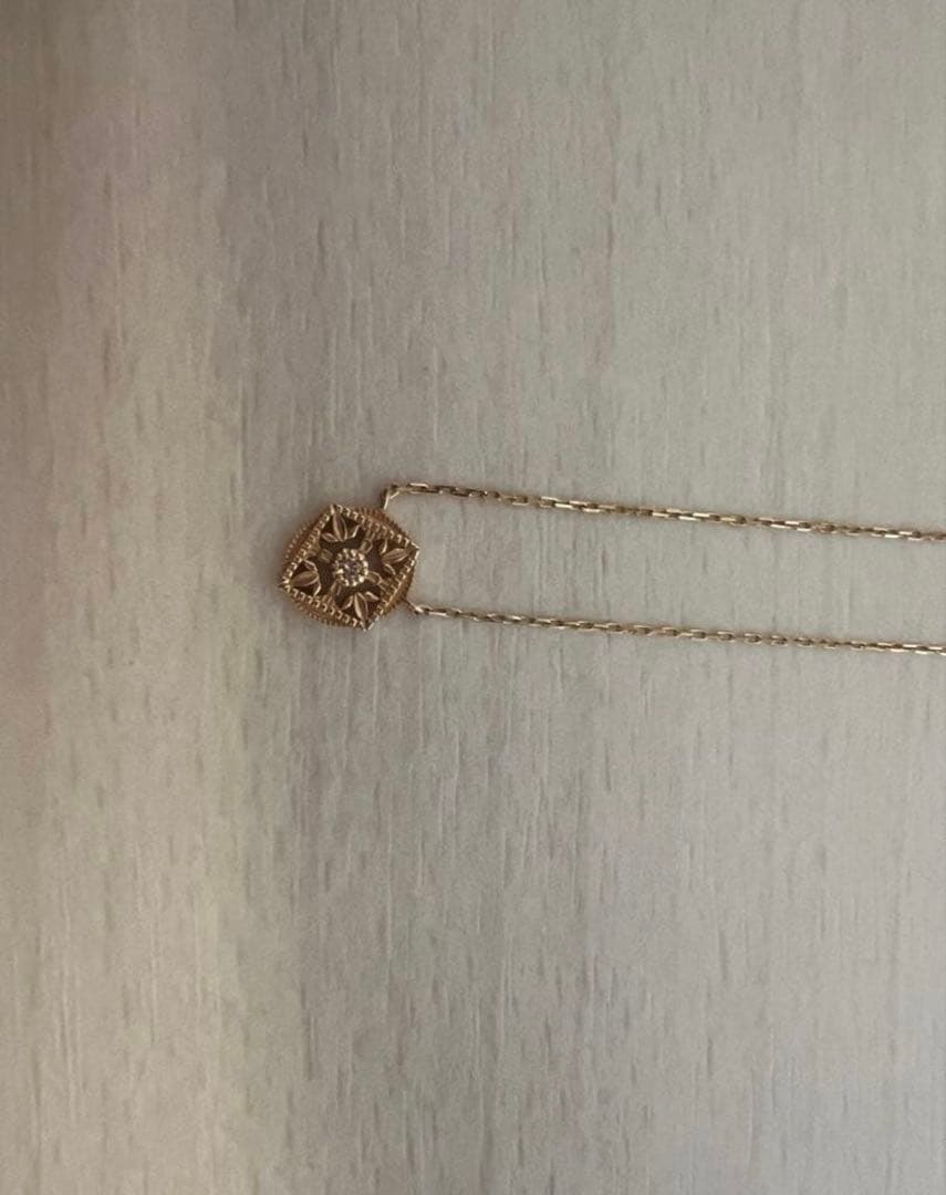 agete K10 gold necklace featuring a 0.01ct diamond pendant on delicate chain