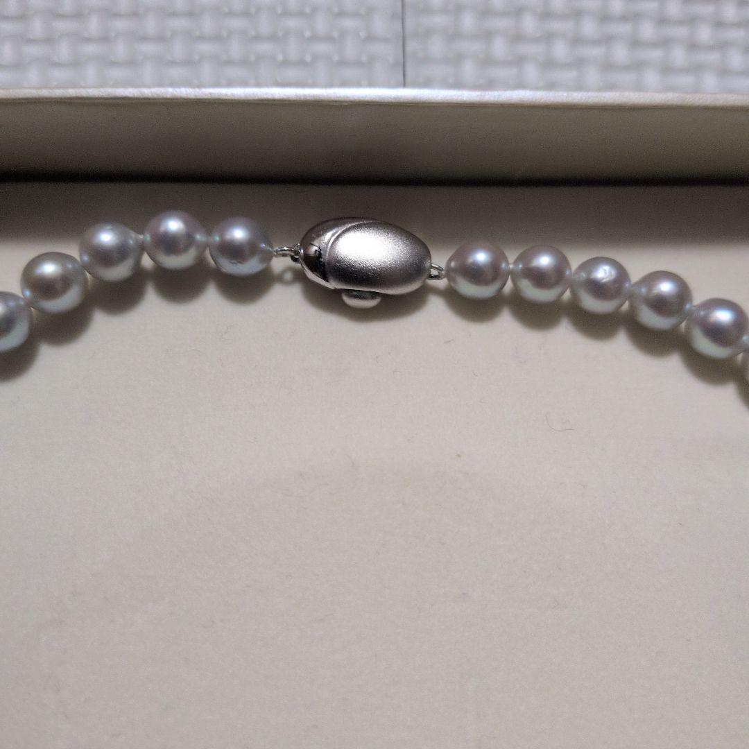 Takashi Pearl Necklace with 7.1-7.4mm pearls, 44cm length, and silver clasp on white background