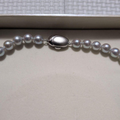 Takashi Pearl Necklace with 7.1-7.4mm pearls, 44cm length, and silver clasp on white background