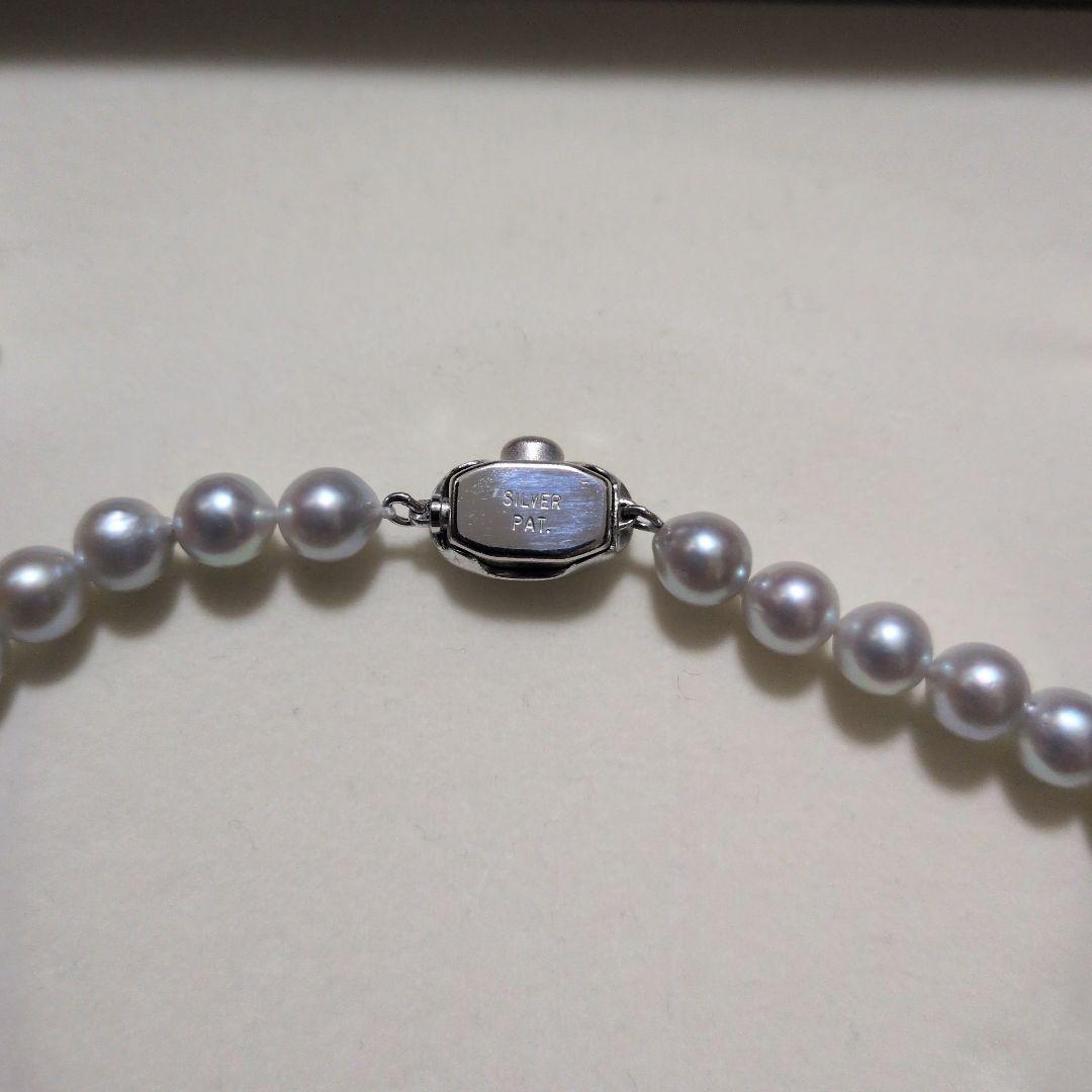 Takashi Pearl Necklace with 7.1-7.4mm pearls, 44cm length, and silver clasp on white background