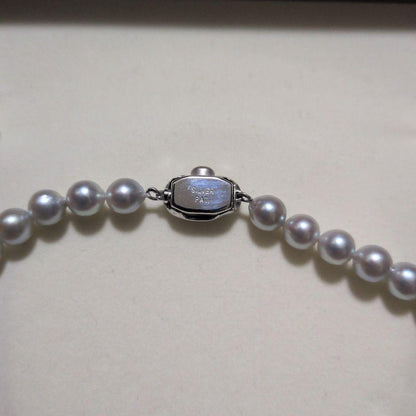 Takashi Pearl Necklace with 7.1-7.4mm pearls, 44cm length, and silver clasp on white background