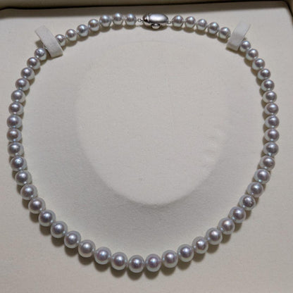 Takashi Pearl Necklace with 7.1-7.4mm pearls, 44cm length, and silver clasp on white background