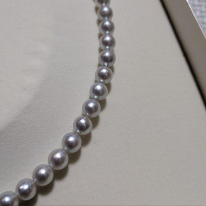 Takashi Pearl Necklace with 7.1-7.4mm pearls, 44cm length, and silver clasp on white background