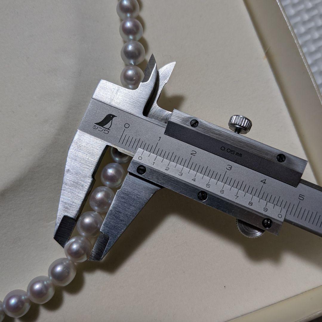 Takashi Pearl Necklace with 7.1-7.4mm pearls, 44cm length, and silver clasp on white background