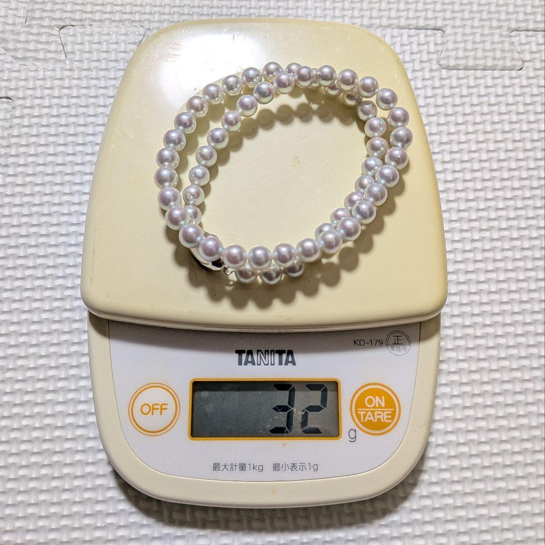 Takashi Pearl Necklace with 7.1-7.4mm pearls, 44cm length, and silver clasp on white background