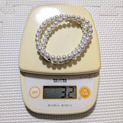 Takashi Pearl Necklace with 7.1-7.4mm pearls, 44cm length, and silver clasp on white background
