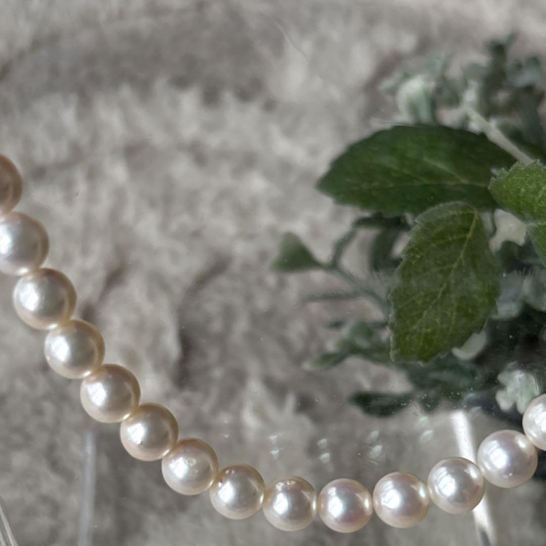 Akoya pearl necklace featuring 7mm white round beads on a 42cm silver-stamped string