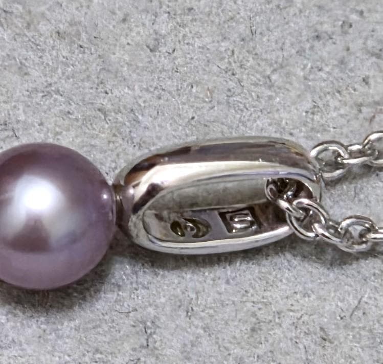 Tasaki Pearl necklace with three multi-color baby pearls on a silver chain about 42cm long
