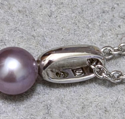 Tasaki Pearl necklace with three multi-color baby pearls on a silver chain about 42cm long