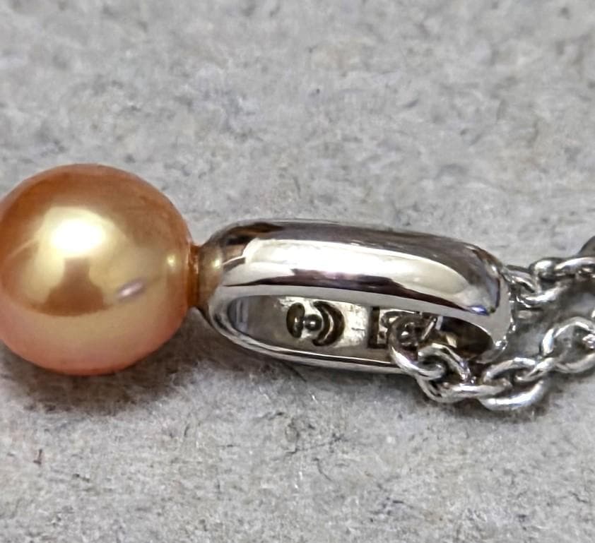 Tasaki Pearl necklace with three multi-color baby pearls on a silver chain about 42cm long