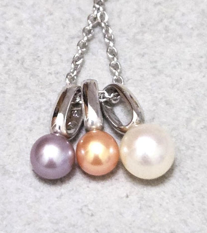 Tasaki Pearl necklace with three multi-color baby pearls on a silver chain about 42cm long