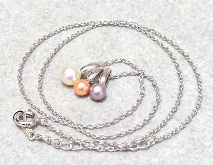 Tasaki Pearl necklace with three multi-color baby pearls on a silver chain about 42cm long