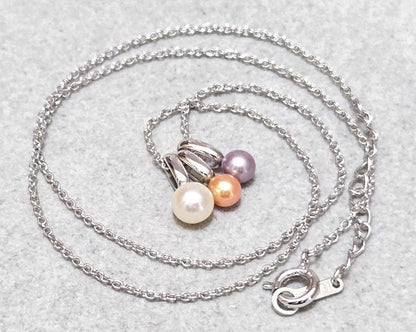 Tasaki Pearl necklace with three multi-color baby pearls on a silver chain about 42cm long