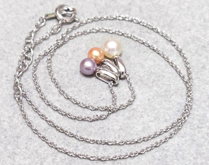 Tasaki Pearl necklace with three multi-color baby pearls on a silver chain about 42cm long