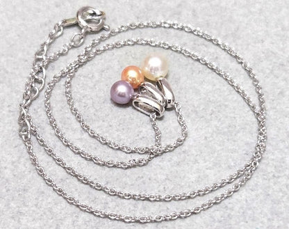 Tasaki Pearl necklace with three multi-color baby pearls on a silver chain about 42cm long