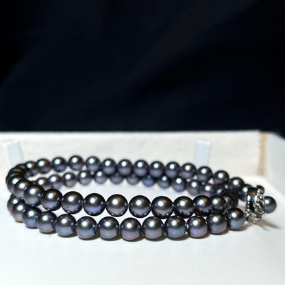 Akoya Pearl Necklace with 6.5-7.0mm round dark purple and dark gray pearls on a silver chain, 42.5cm long