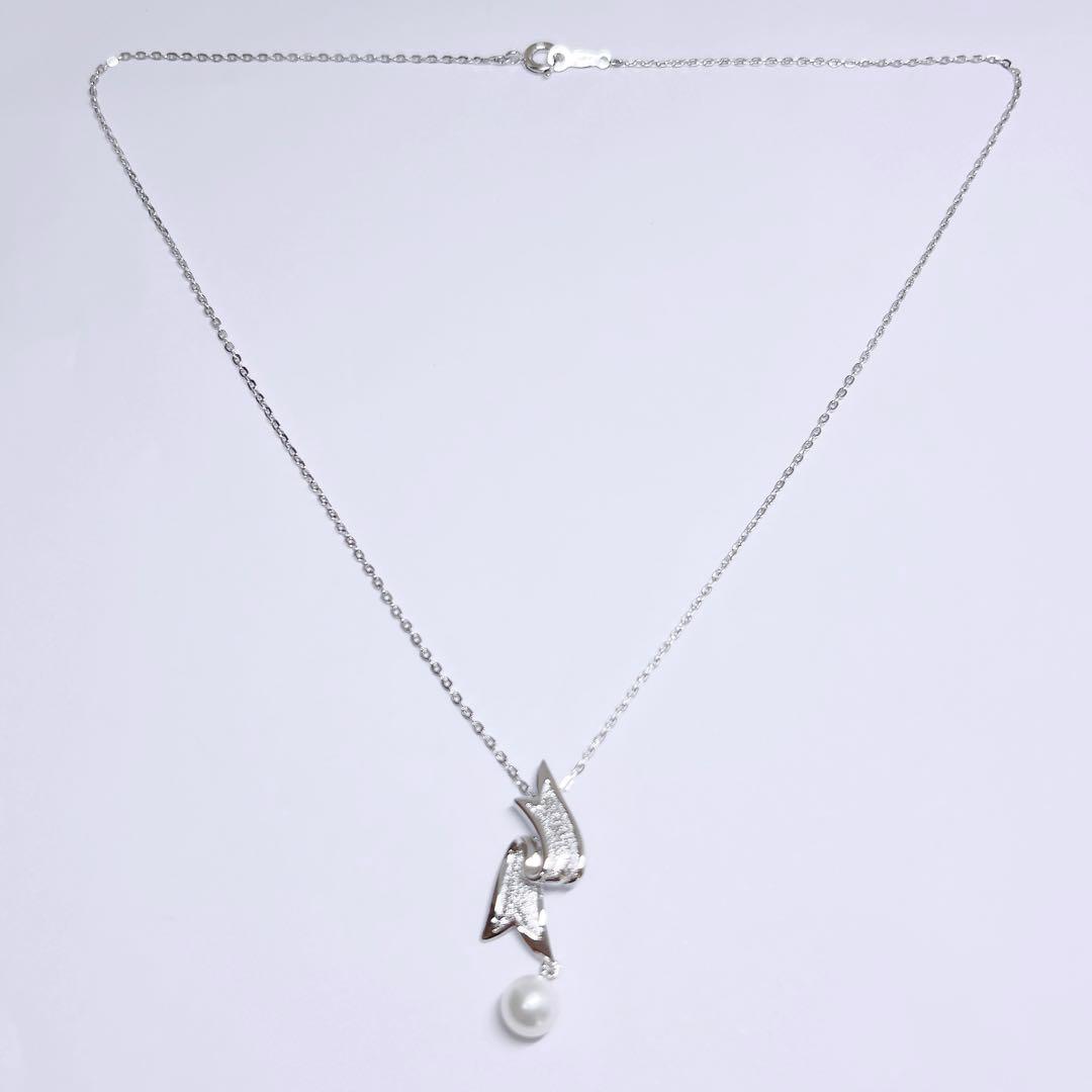 Mikimoto pearl necklace featuring 6.6mm pearls with a silver ribbon pendant on a 41cm chain