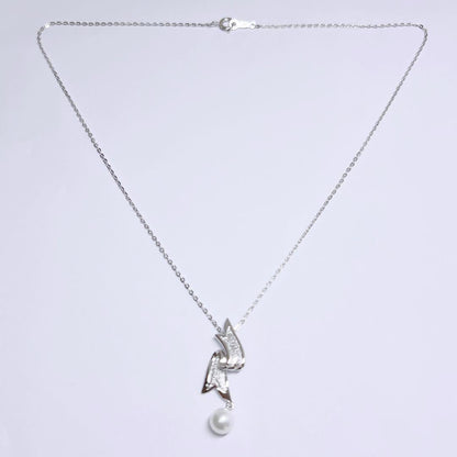 Mikimoto pearl necklace featuring 6.6mm pearls with a silver ribbon pendant on a 41cm chain