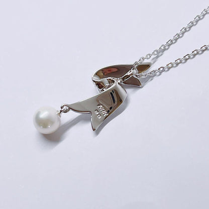 Mikimoto pearl necklace featuring 6.6mm pearls with a silver ribbon pendant on a 41cm chain