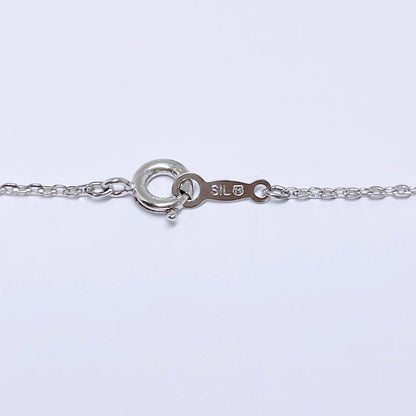 Mikimoto pearl necklace featuring 6.6mm pearls with a silver ribbon pendant on a 41cm chain