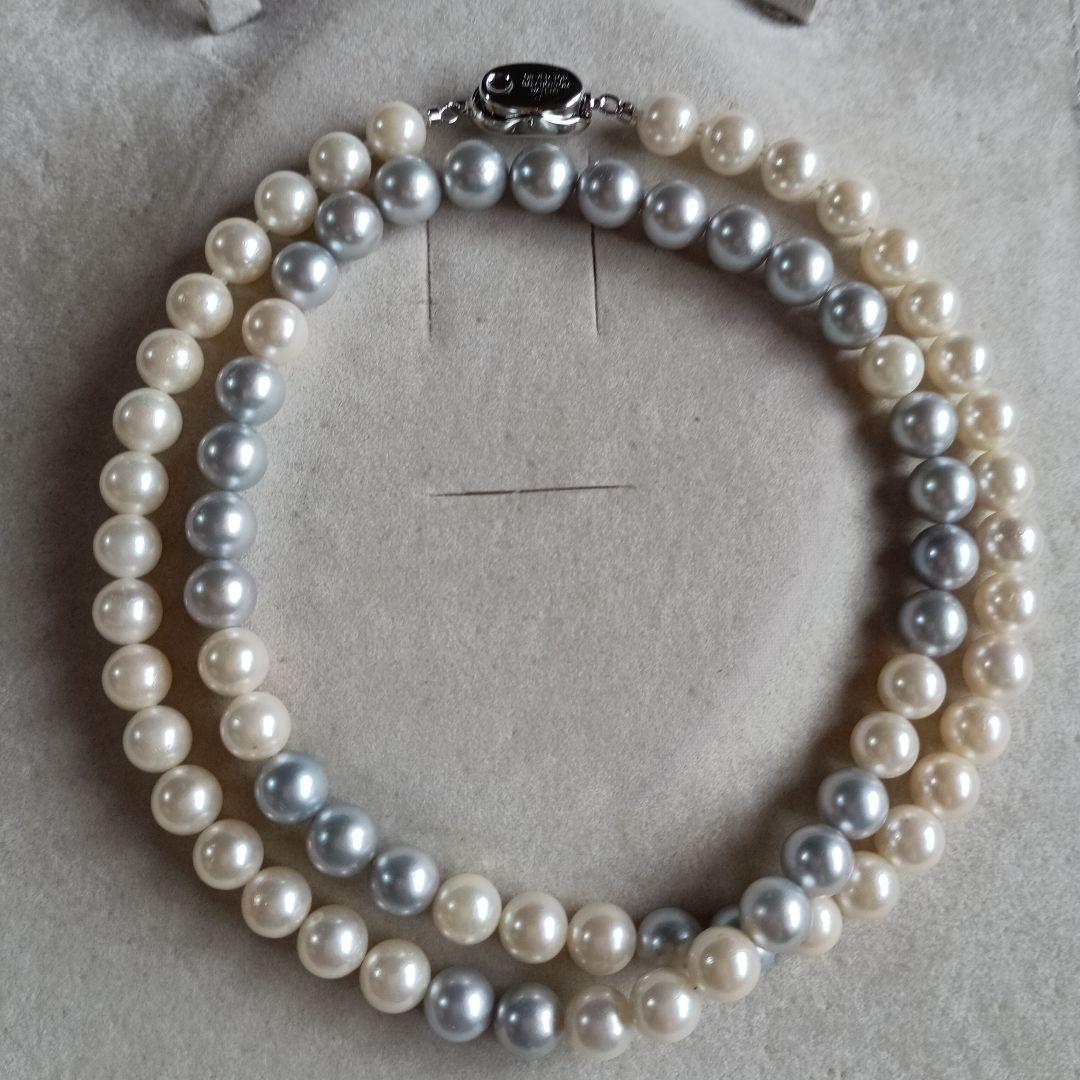 Akoya Pearl Semi-Long Necklace 87 featuring white and light gray pearls with silver clasp on a white background