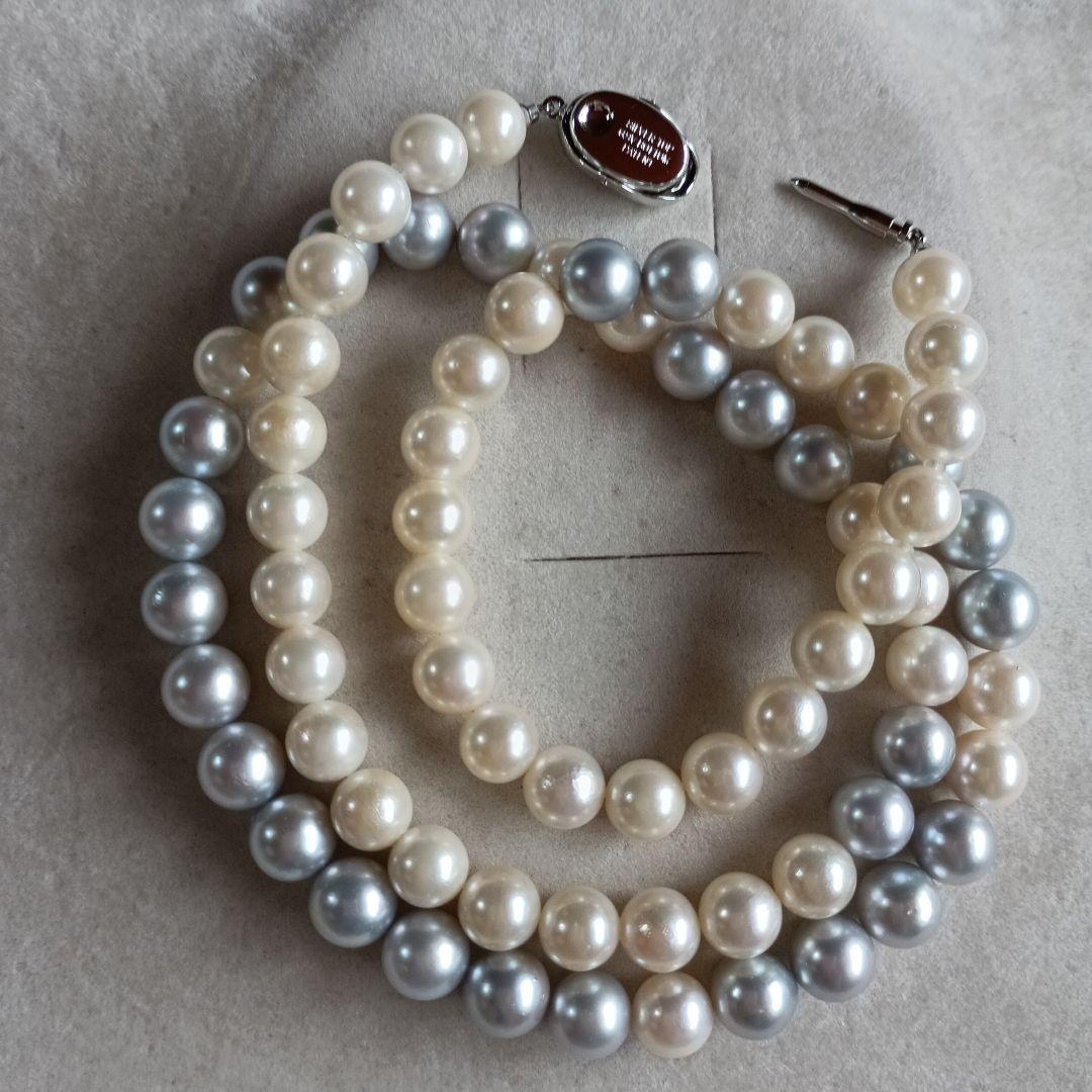 Akoya Pearl Semi-Long Necklace 87 featuring white and light gray pearls with silver clasp on a white background
