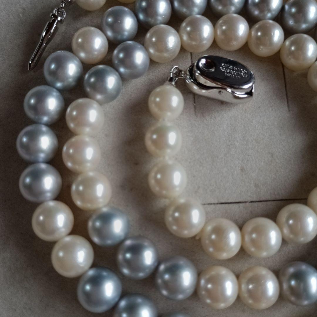 Akoya Pearl Semi-Long Necklace 87 featuring white and light gray pearls with silver clasp on a white background