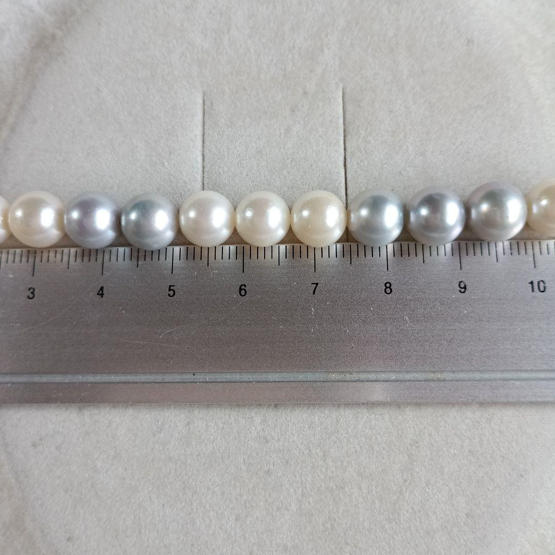 Akoya Pearl Semi-Long Necklace 87 featuring white and light gray pearls with silver clasp on a white background