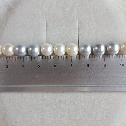 Akoya Pearl Semi-Long Necklace 87 featuring white and light gray pearls with silver clasp on a white background