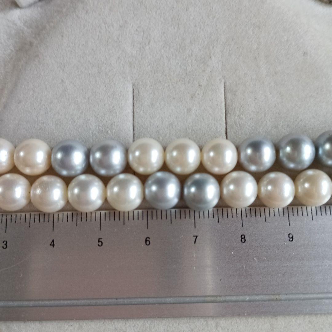Akoya Pearl Semi-Long Necklace 87 featuring white and light gray pearls with silver clasp on a white background