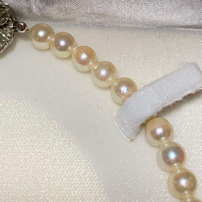 Akoya pearl necklace with silver clasp showing 7mm pearls on a 43 cm strand