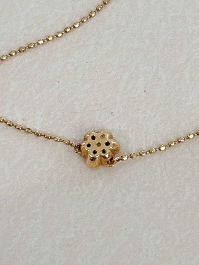 Agete flower motif necklace with 0.08ct diamond and adjustable 40.5 cm chain on white background