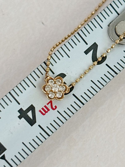 Agete flower motif necklace with 0.08ct diamond and adjustable 40.5 cm chain on white background