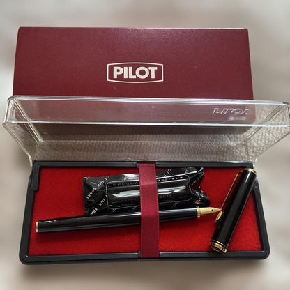 Pilot black fountain pen with gold decorations, included case, and two ink cartridges