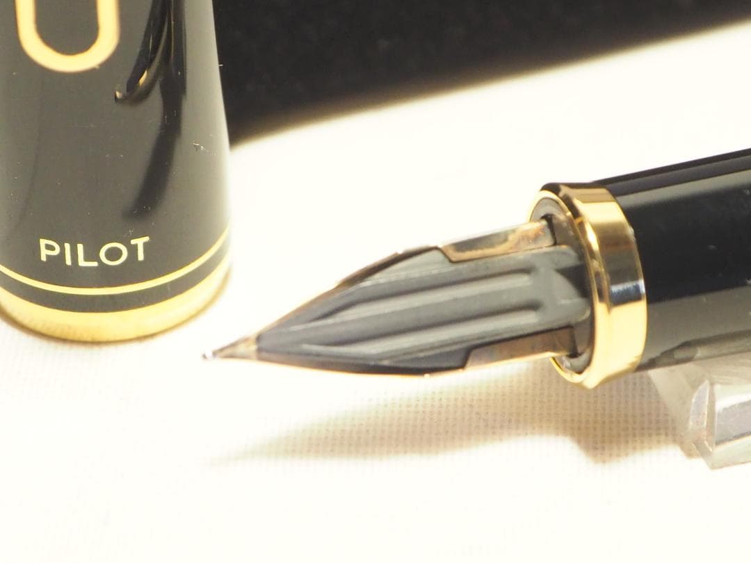 Pilot Fountain Pen Black Gold with 14K fine nib and included black case on white background