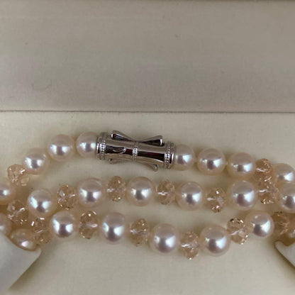 TASAKI pink pearl long necklace displayed on white background