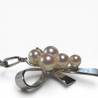 Mikimoto pearl pendant necklace with silver ribbon design and five pearls on a 40.5cm chain