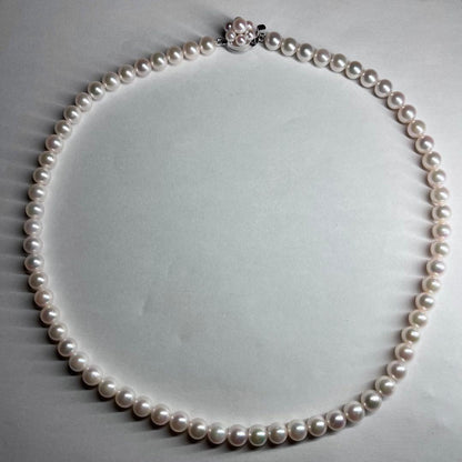 Tasaki Akoya pearl necklace with 6.0-6.5mm white round pearls, 42cm length, silver clasp, all knot style setting