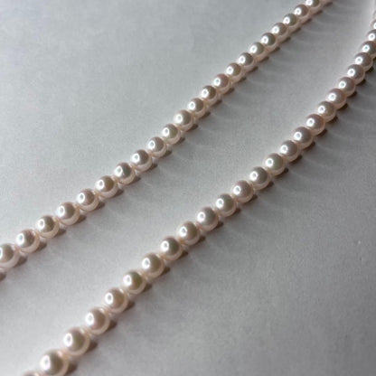 Tasaki Akoya pearl necklace with 6.0-6.5mm white round pearls, 42cm length, silver clasp, all knot style setting