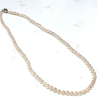 Akoya pearl semi-long necklace approx 64cm with 6-6.5mm white pearls showing slight irregularities and strong luster